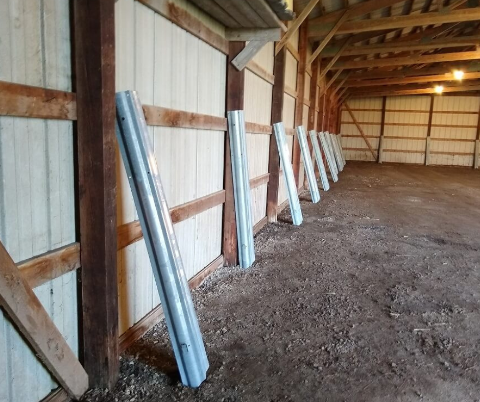 inside of pole barn with repair sleeves on columns