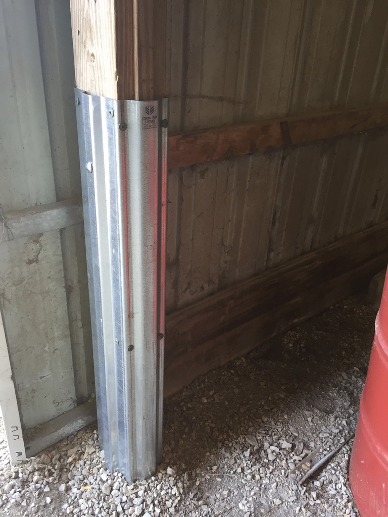 A pole barn is seen during the repair process. The Pole Barn Saver performs rotted post repair near you in Pennsylvania.