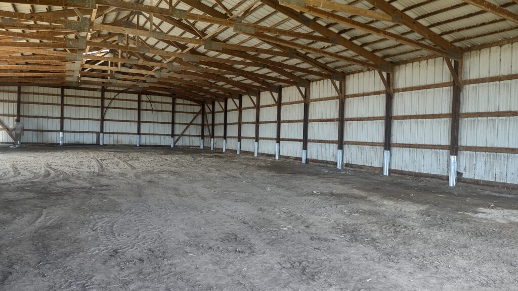 A barn with column repair services done with The Pro Barn Saver’s column repair sleeves